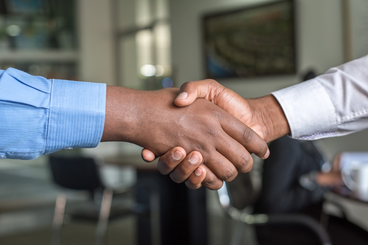 Two professionals meeting and shaking hands